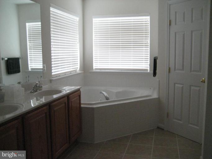 2010 Myrtlewood Road Baltimore, MD 21209 - Photo 6 of 11 a bathroom with a bathtub and a sink