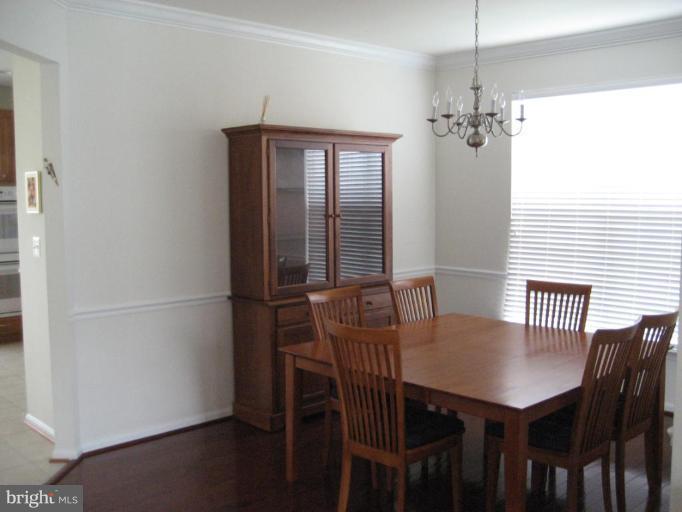 2010 Myrtlewood Road Baltimore, MD 21209 - Photo 7 of 11 a view of a dining room with furniture window and wooden floor