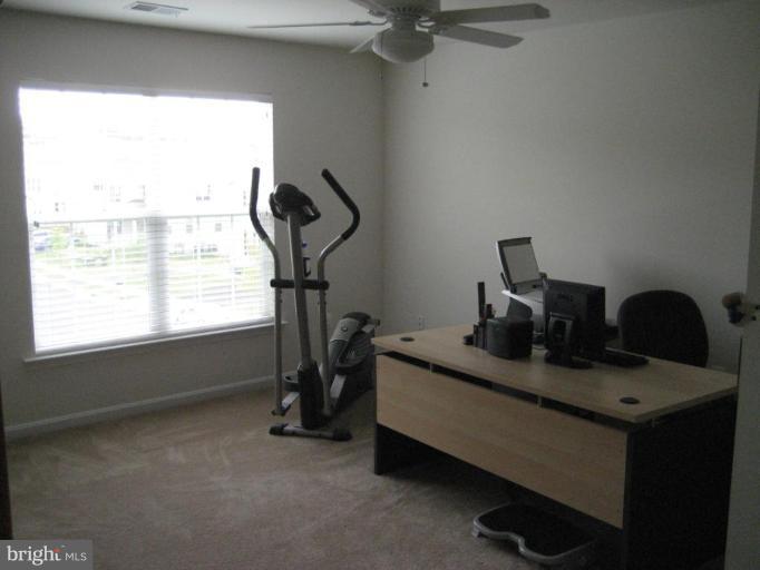 2010 Myrtlewood Road Baltimore, MD 21209 - Photo 8 of 11 a view of a workspace with furniture and a window