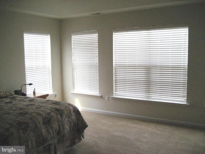 2010 Myrtlewood Road Baltimore, MD 21209 - Photo 10 of 11 a bedroom with a bed and a window