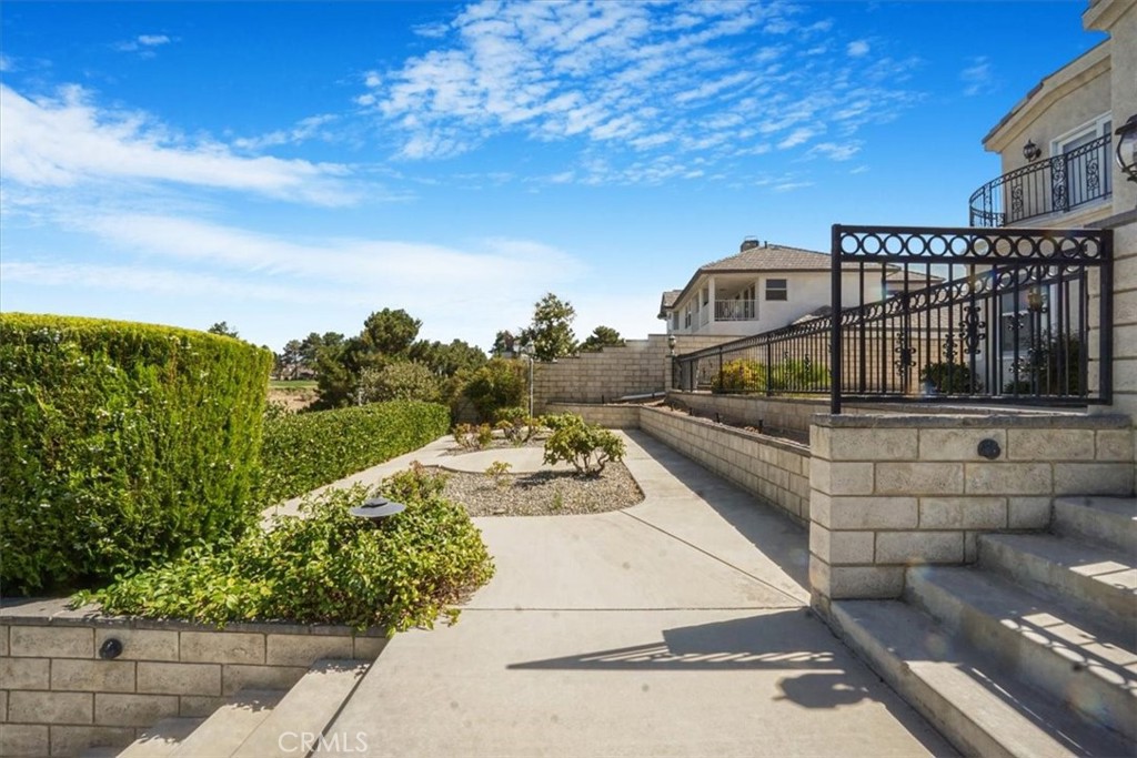 13097 Sage Hen Road Victorville, CA 92395 - Photo 15 of 63 a view of a balcony with two chairs