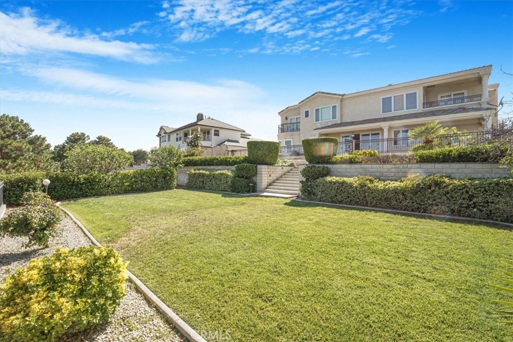 13097 Sage Hen Road Victorville, CA 92395 - Photo 19 of 63 a building view with a ocean view