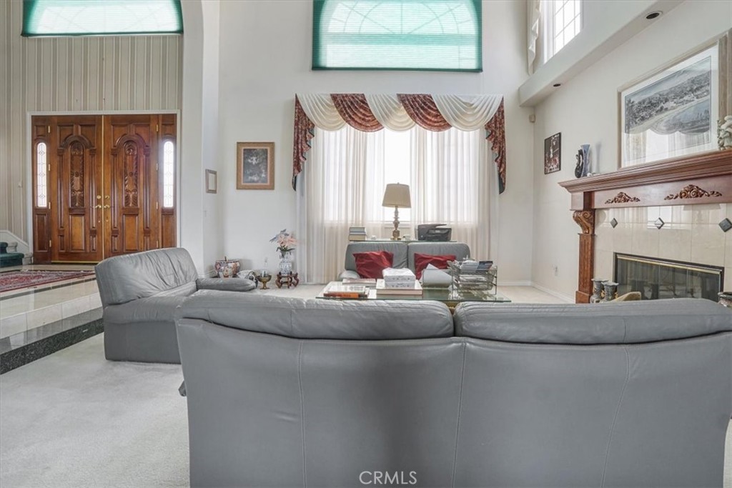 13097 Sage Hen Road Victorville, CA 92395 - Photo 27 of 63 a living room with fireplace furniture and a fireplace