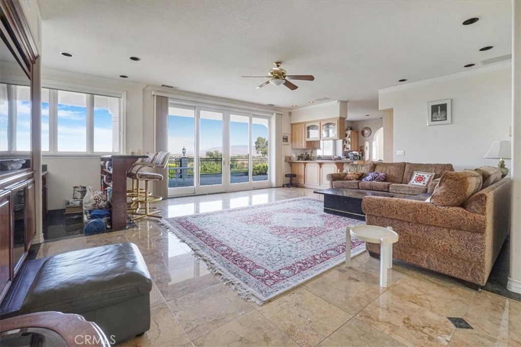 13097 Sage Hen Road Victorville, CA 92395 - Photo 29 of 63 a living room with furniture rug and window