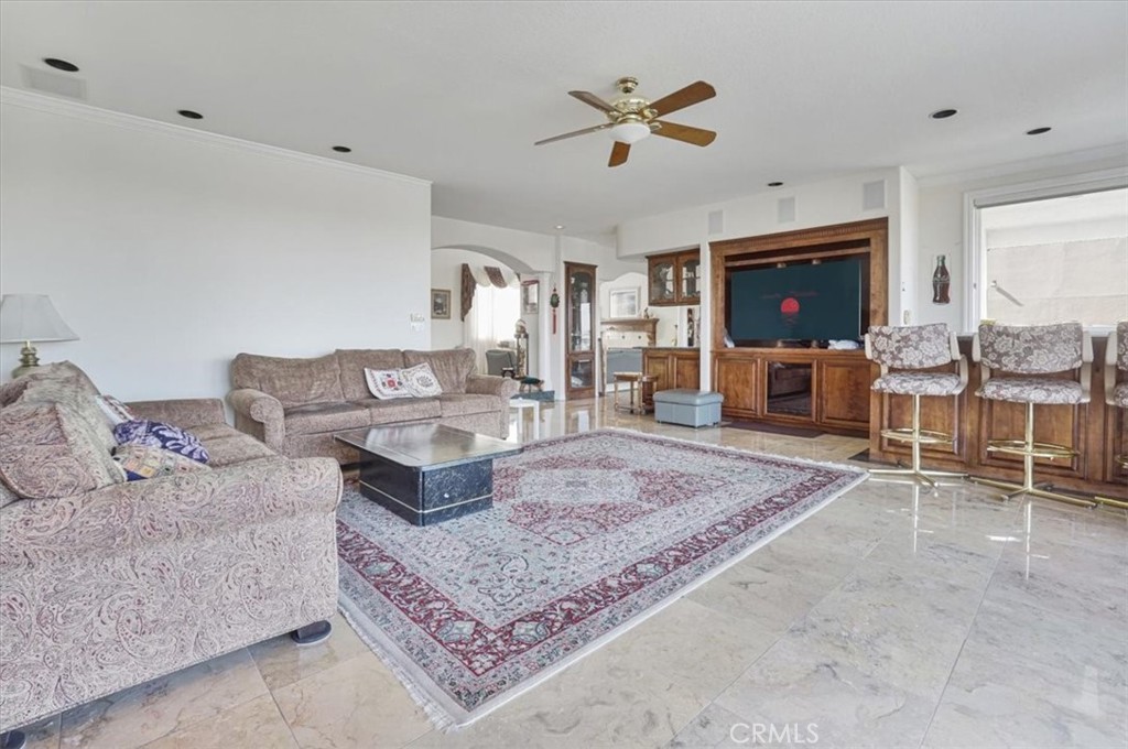 13097 Sage Hen Road Victorville, CA 92395 - Photo 31 of 63 a living room with furniture and a flat screen tv