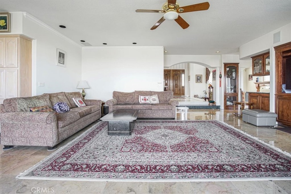 13097 Sage Hen Road Victorville, CA 92395 - Photo 32 of 63 a living room with furniture and a rug