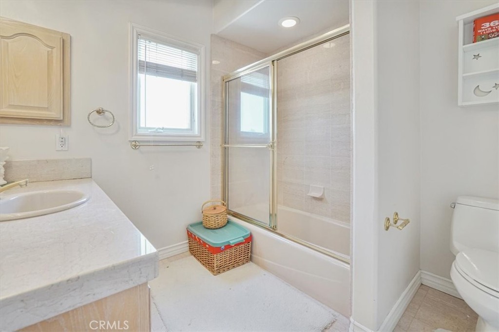 13097 Sage Hen Road Victorville, CA 92395 - Photo 47 of 63 a bathroom with a sink toilet and shower