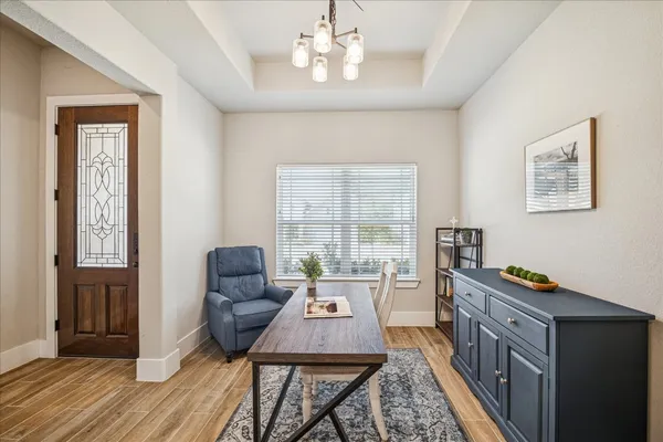 a view of a livingroom with furniture and a table