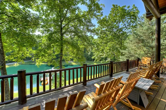 a kitchen with stainless steel appliances granite countertop a sink a stove a refrigerator and cabinets