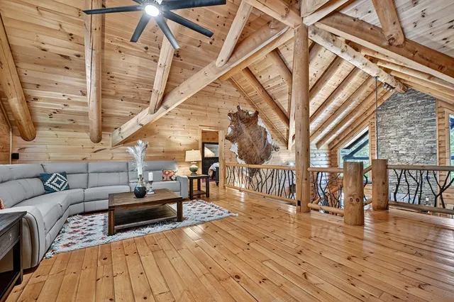 a kitchen with kitchen island a dining table chairs cabinets and a sink