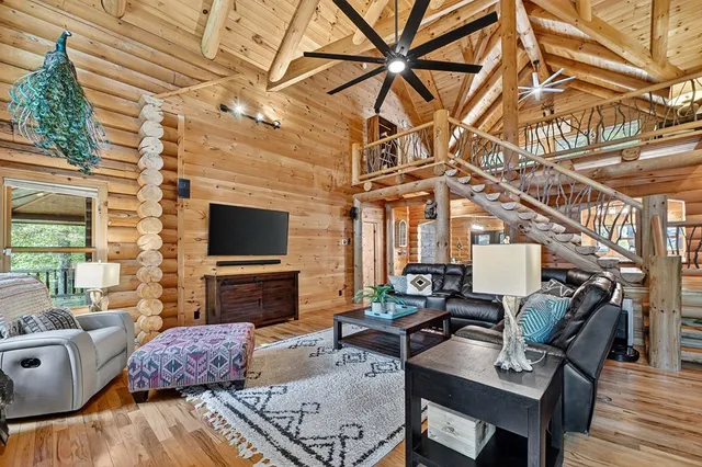 a view of a room with furniture window and wooden floor