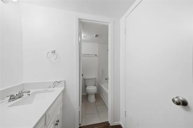 a bathroom with a toilet and a bathtub