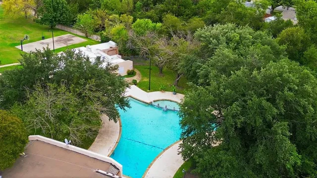 an aerial view of a house with yard swimming pool and outdoor seating