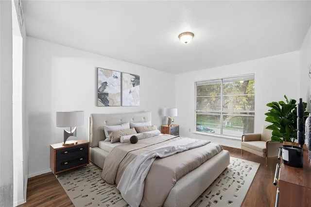 a bedroom with a large bed and a couch