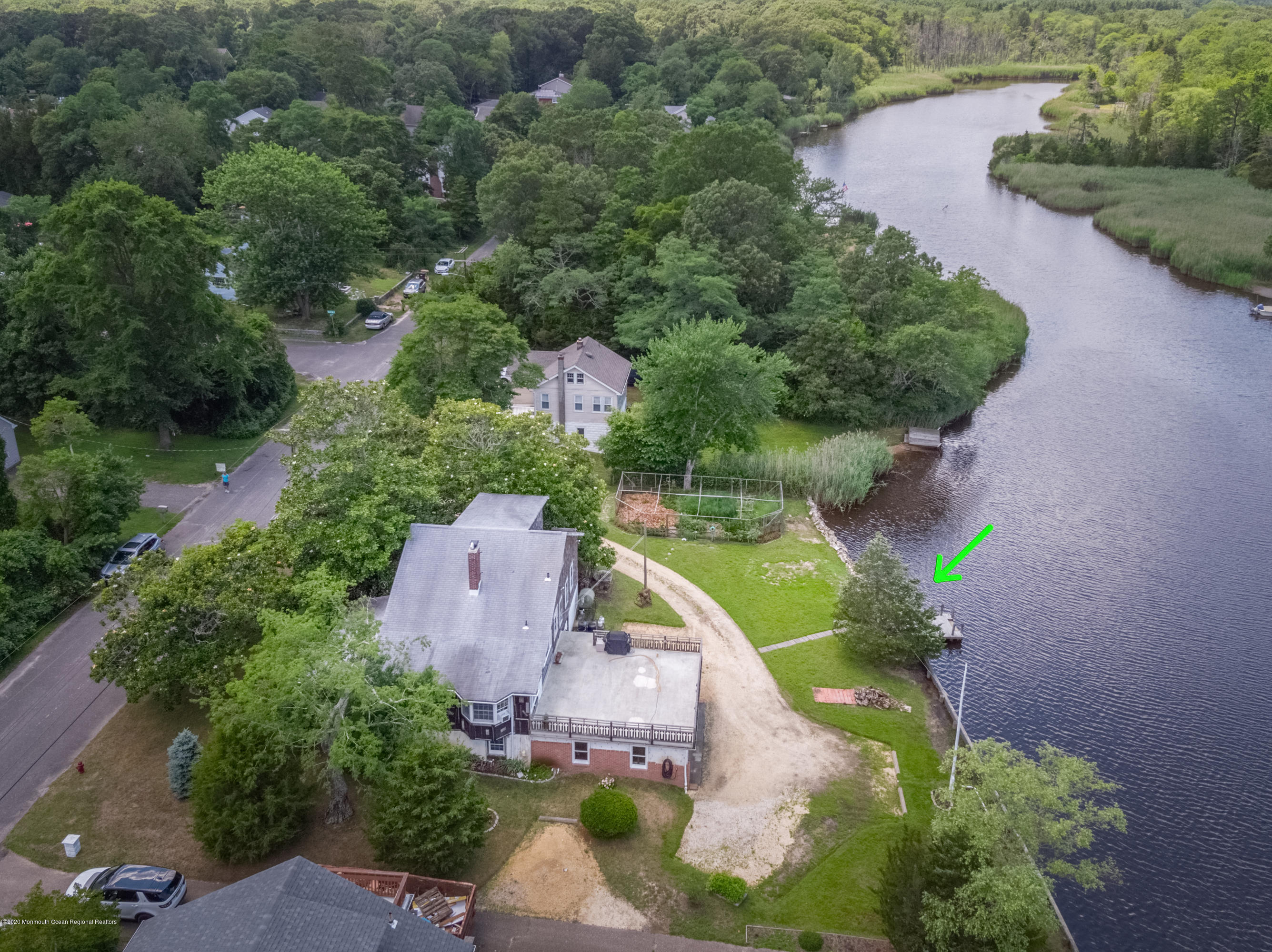 607 Riverside Drive Bayville, NJ 08721 - Photo 6 of 10 an aerial view of a house with a garden and swimming pool
