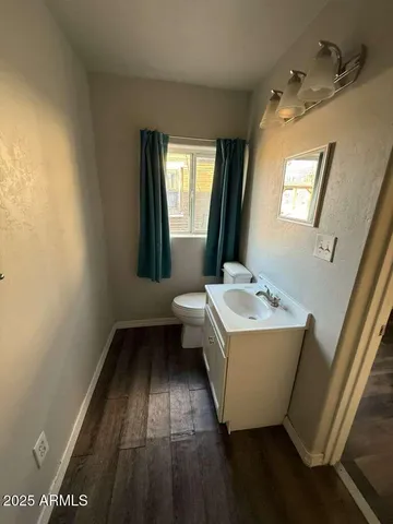 a bathroom with a bathtub sink and mirror