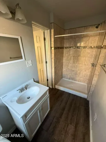 a bathroom with a sink and a mirror