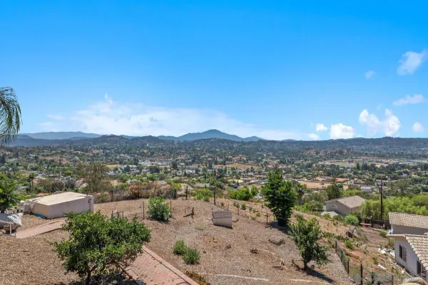 a view of a city with mountains in the background