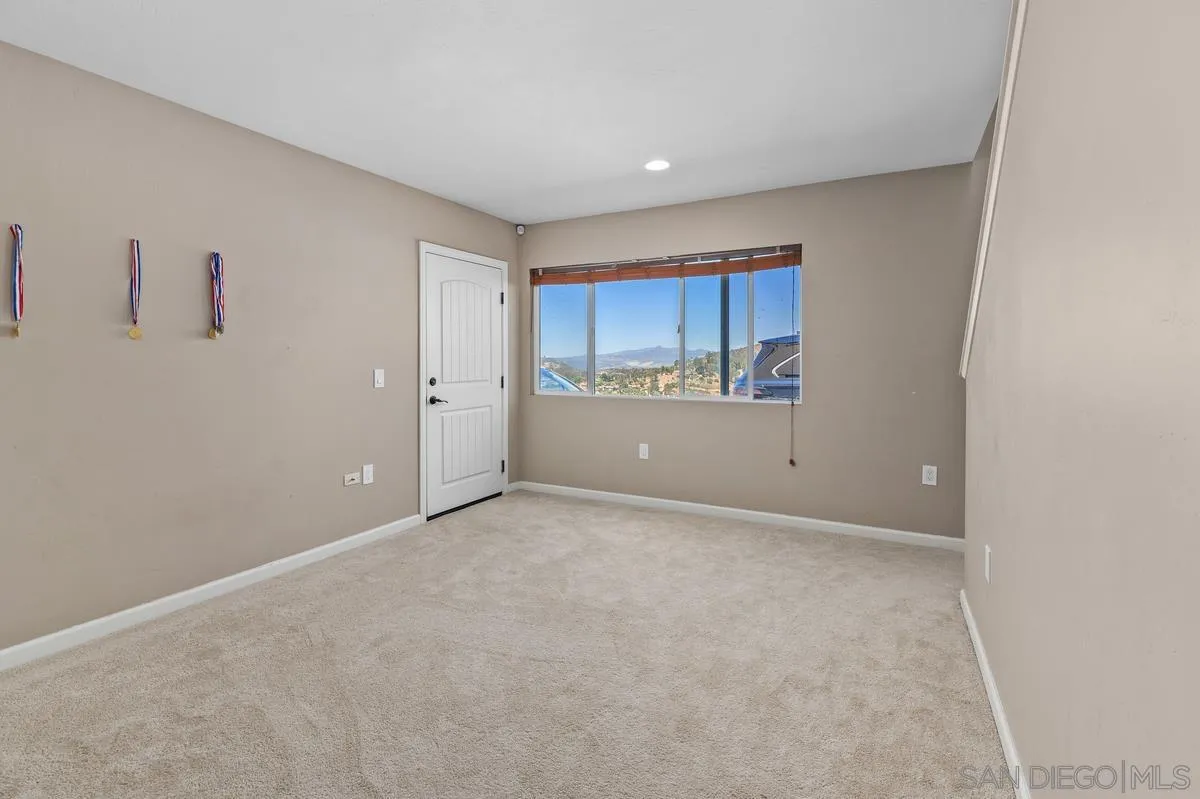 2155 Vista Valley Rim Place El Cajon, CA 92019 - Photo 25 of 61 a view of a kitchen with a sink and cabinets