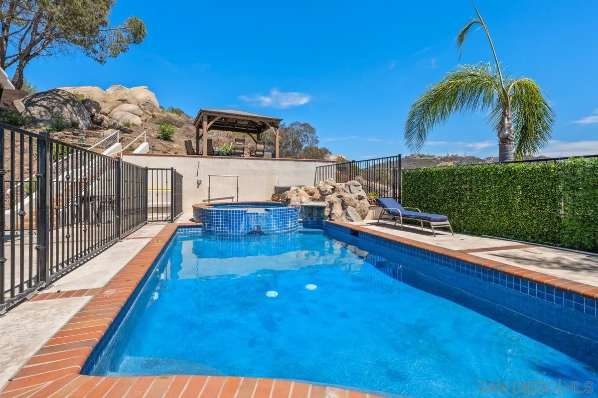 2155 Vista Valley Rim Place El Cajon, CA 92019 - Photo 33 of 61 a view of swimming pool with a lounge chairs