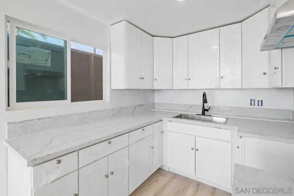 a view of kitchen with wooden floor