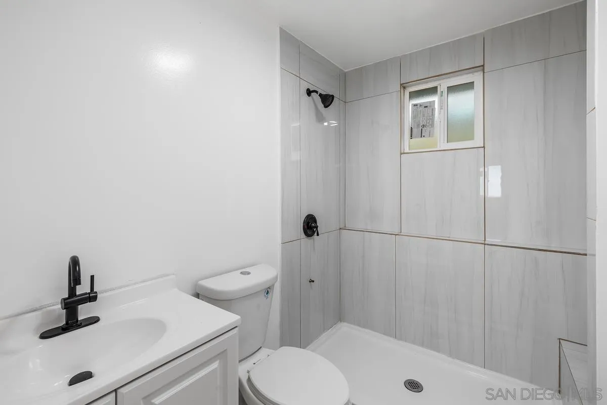 2155 Vista Valley Rim Place El Cajon, CA 92019 - Photo 44 of 61 a bathroom with a sink a toilet and shower