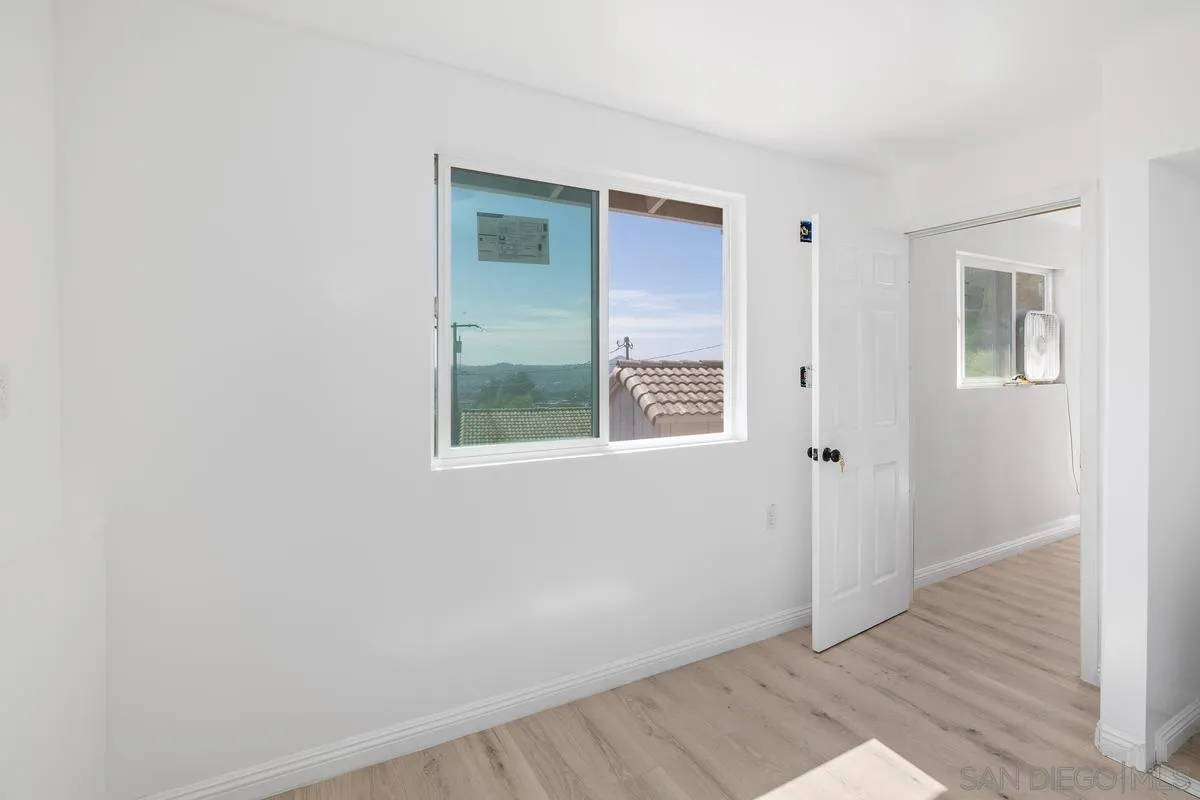 2155 Vista Valley Rim Place El Cajon, CA 92019 - Photo 48 of 61 an empty room with windows and closet