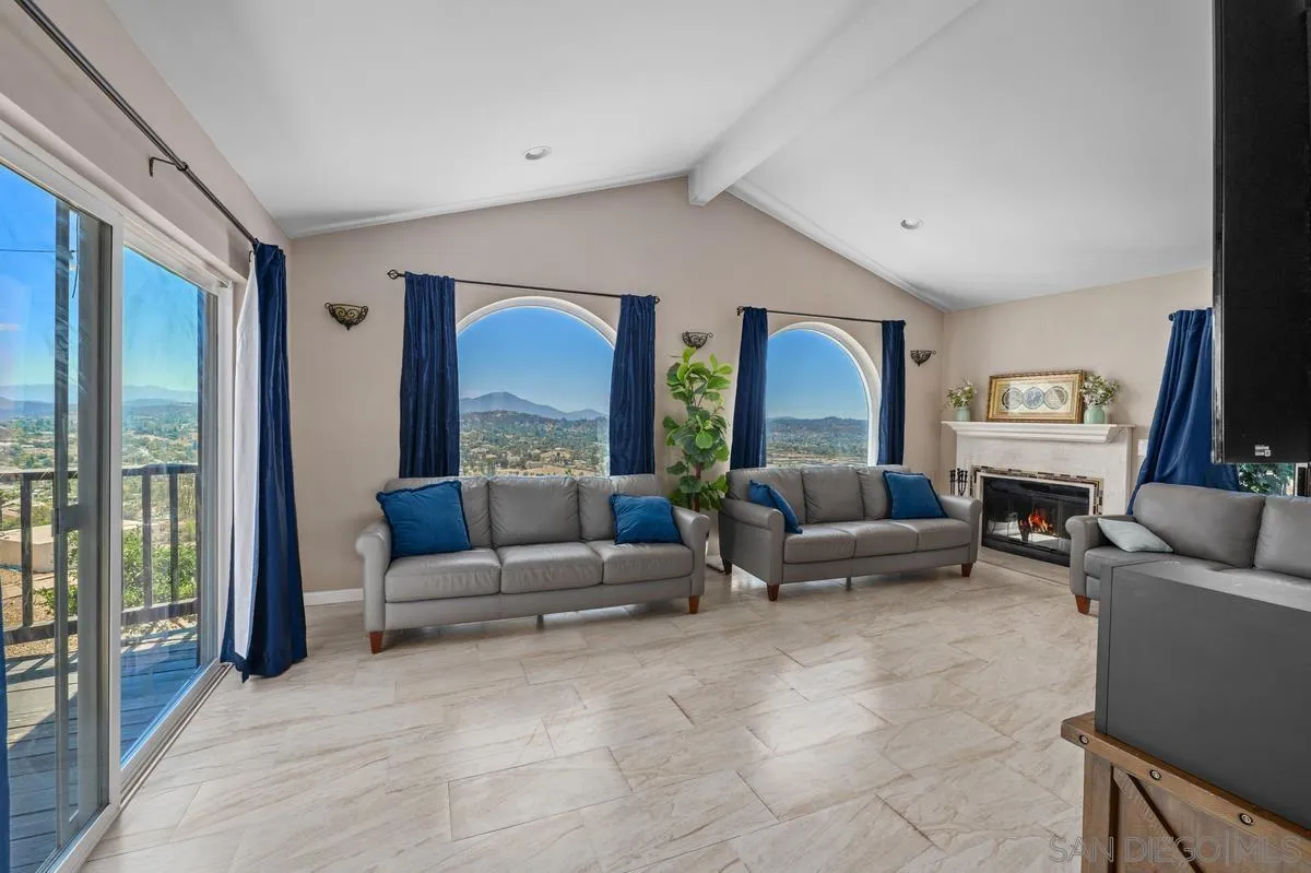 2155 Vista Valley Rim Place El Cajon, CA 92019 - Photo 9 of 61 a living room with furniture and a large window