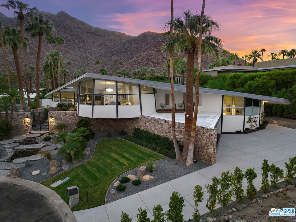 1350 Ladera Circle Palm Springs, CA 92262 - Photo 1 of 54 a front view of a house with garden