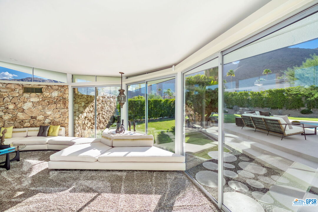1350 Ladera Circle Palm Springs, CA 92262 - Photo 17 of 54 a living room with large windows