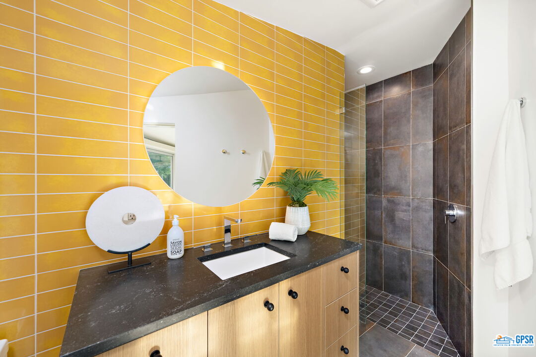 1350 Ladera Circle Palm Springs, CA 92262 - Photo 28 of 54 a bathroom with a sink mirror and vanity