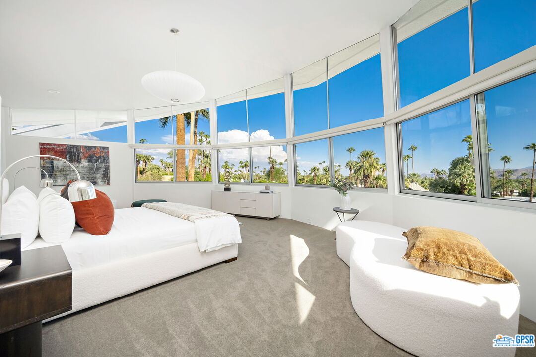 1350 Ladera Circle Palm Springs, CA 92262 - Photo 31 of 54 a bed room with a bed and a large window