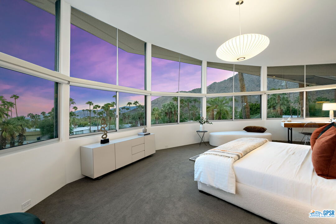 1350 Ladera Circle Palm Springs, CA 92262 - Photo 32 of 54 a bedroom with two beds and large windows