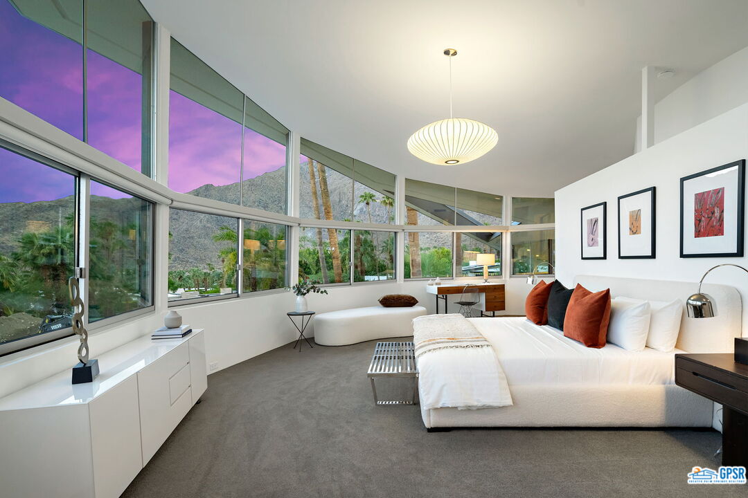 1350 Ladera Circle Palm Springs, CA 92262 - Photo 33 of 54 a bedroom with furniture and large windows