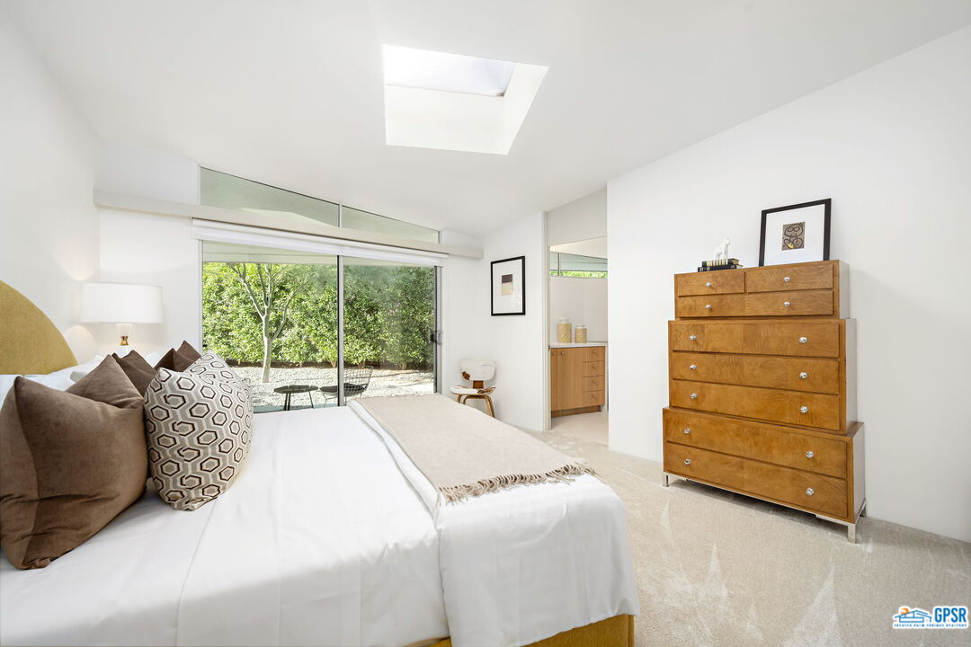 1350 Ladera Circle Palm Springs, CA 92262 - Photo 38 of 54 a bedroom with a bed and a dresser