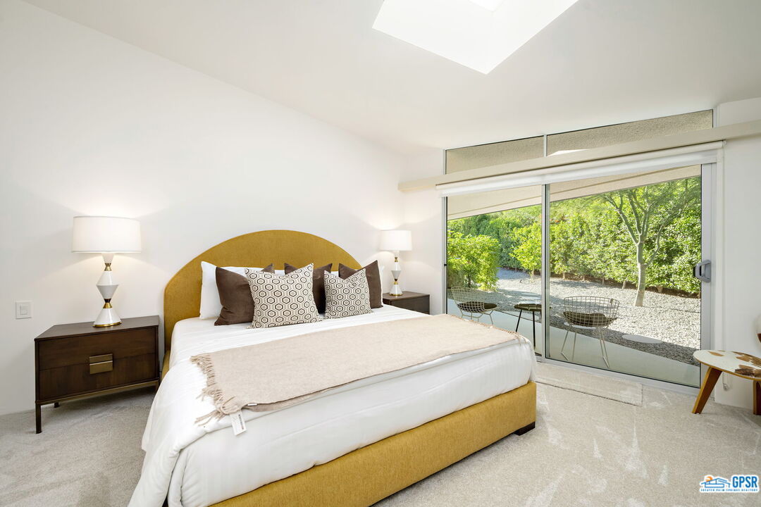 1350 Ladera Circle Palm Springs, CA 92262 - Photo 39 of 54 a bedroom with a bed and a large window