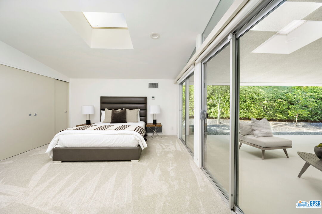 1350 Ladera Circle Palm Springs, CA 92262 - Photo 43 of 54 a bedroom with a large bed and a large window