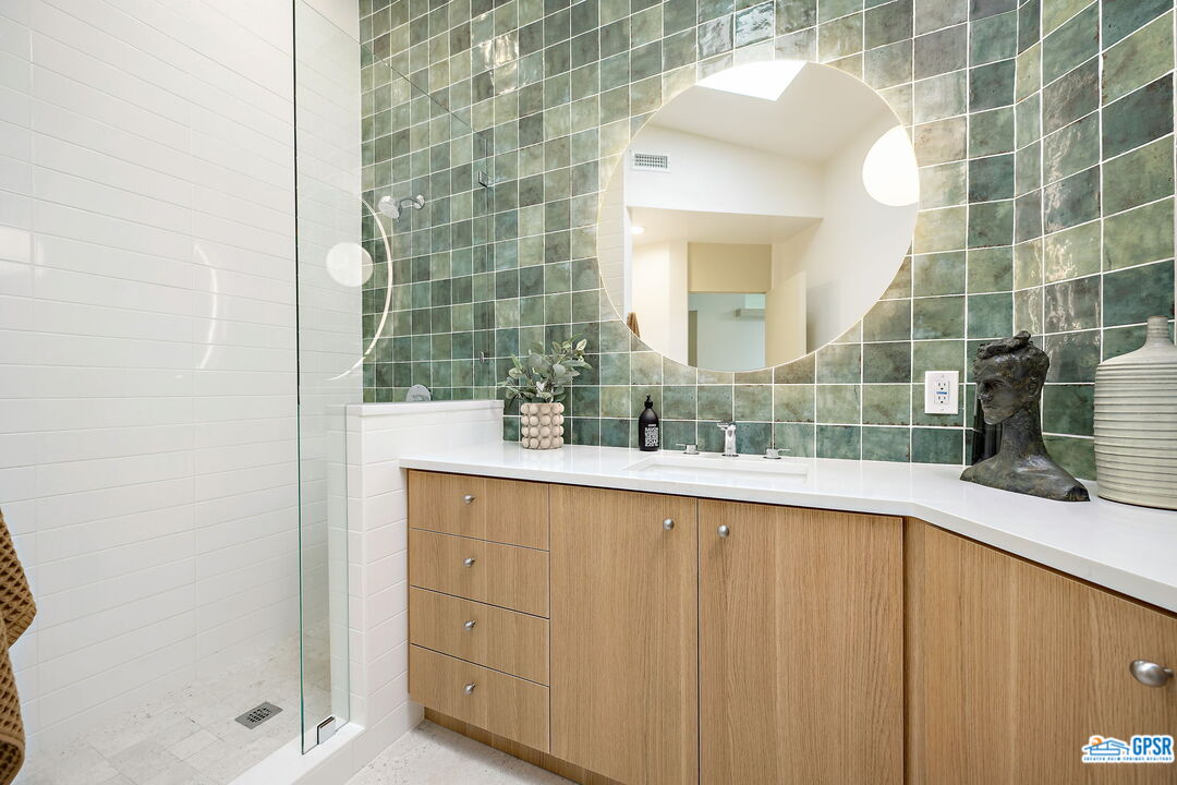 1350 Ladera Circle Palm Springs, CA 92262 - Photo 44 of 54 a bathroom with a sink and a mirror