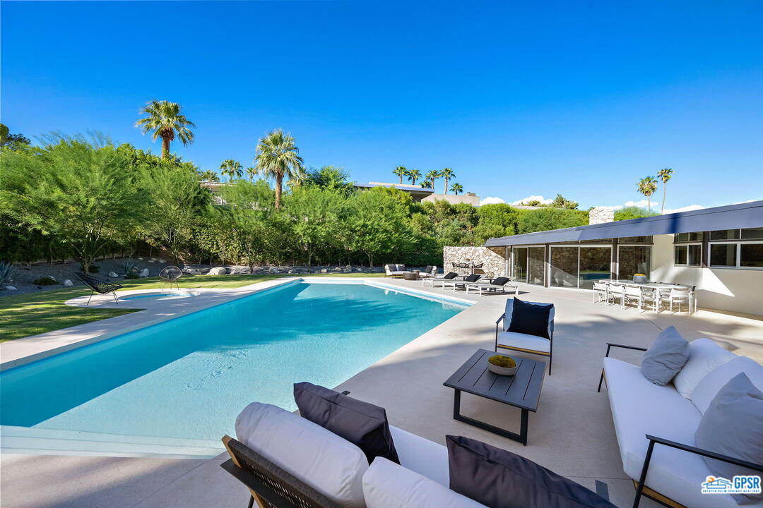 1350 Ladera Circle Palm Springs, CA 92262 - Photo 48 of 54 a view of a swimming pool with a patio