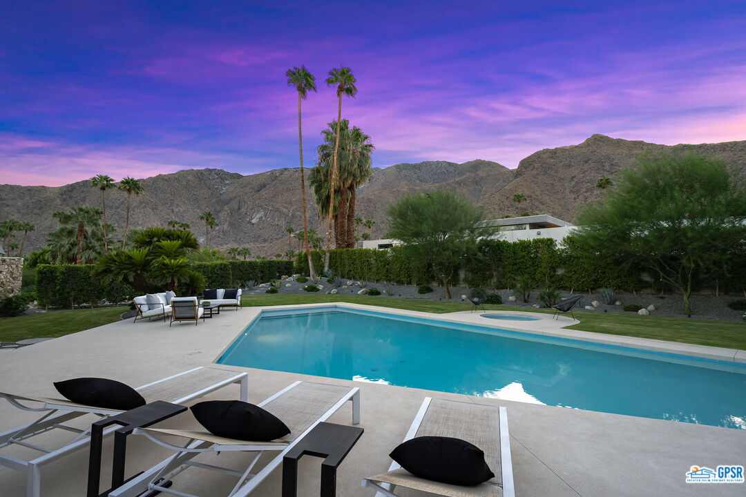 1350 Ladera Circle Palm Springs, CA 92262 - Photo 49 of 54 a view of a swimming pool with lounge chairs