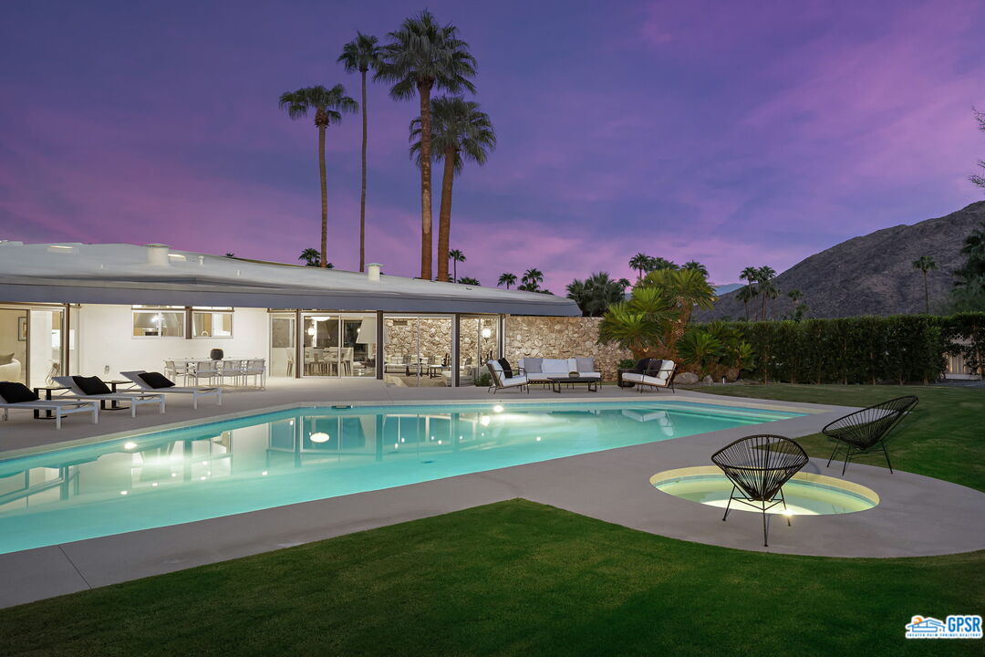 1350 Ladera Circle Palm Springs, CA 92262 - Photo 50 of 54 a view of a house with swimming pool and a yard
