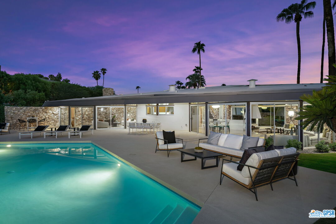1350 Ladera Circle Palm Springs, CA 92262 - Photo 52 of 54 a swimming pool with outdoor seating and yard