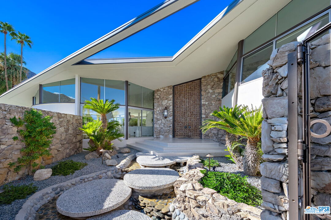 1350 Ladera Circle Palm Springs, CA 92262 - Photo 6 of 54 a backyard of a house with chair table and chairs