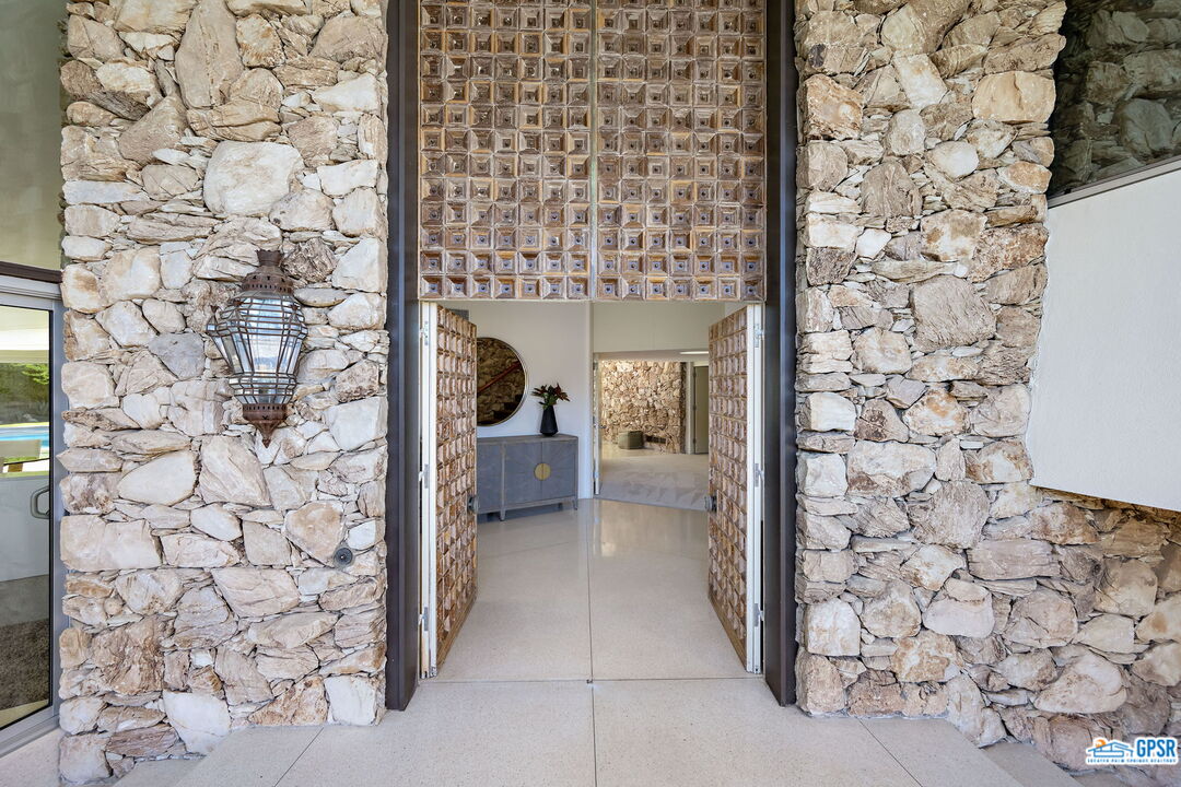 1350 Ladera Circle Palm Springs, CA 92262 - Photo 8 of 54 a view of a bathroom with a sink and a shower curtain