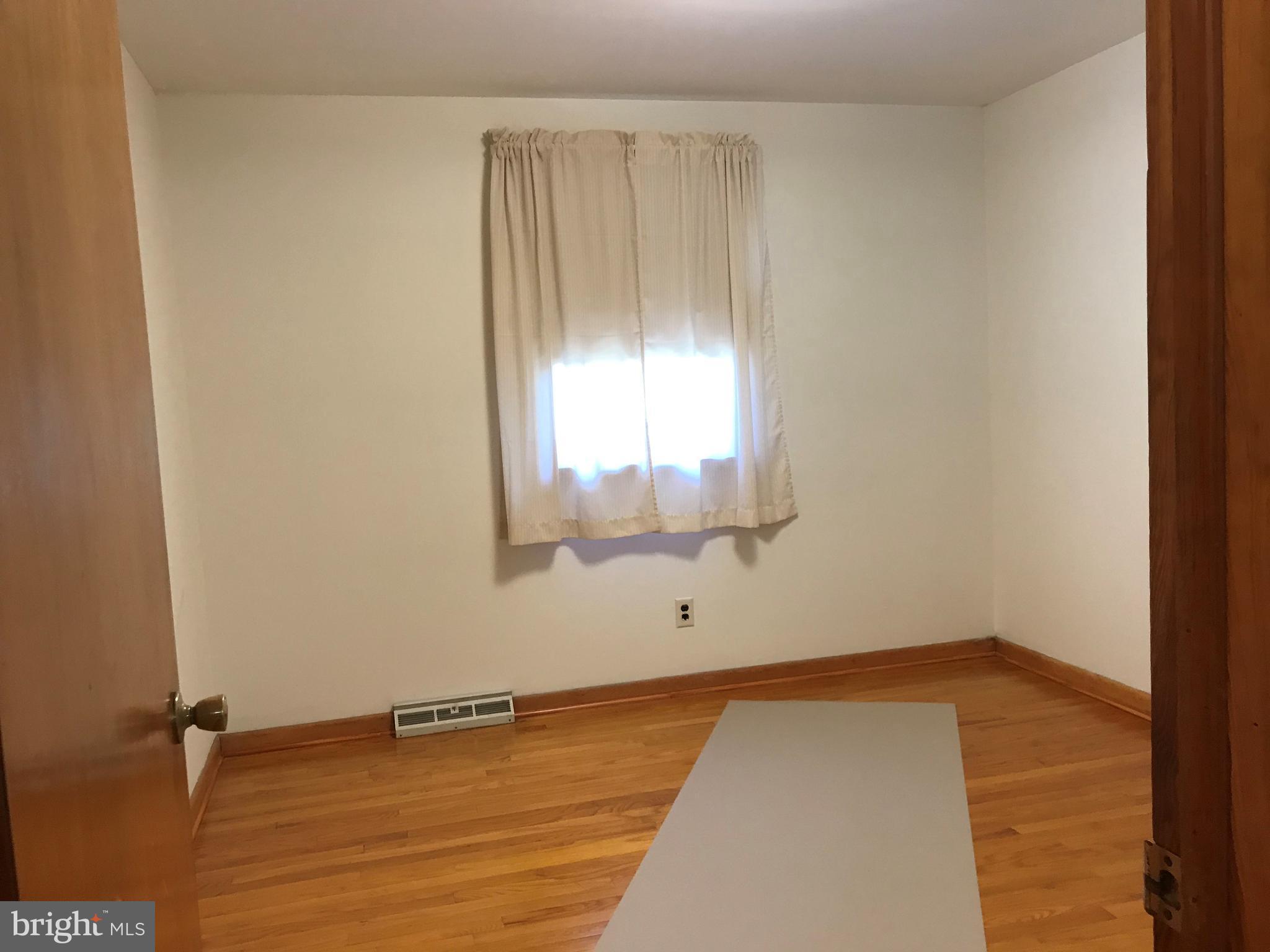 2306 Ruth Avenue Baltimore, MD 21219 - Photo 11 of 19 an empty room with a window