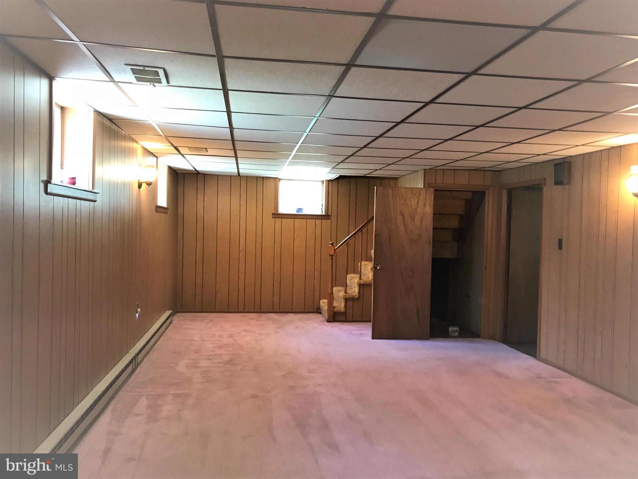 2306 Ruth Avenue Baltimore, MD 21219 - Photo 13 of 19 a view of empty room with wooden walls