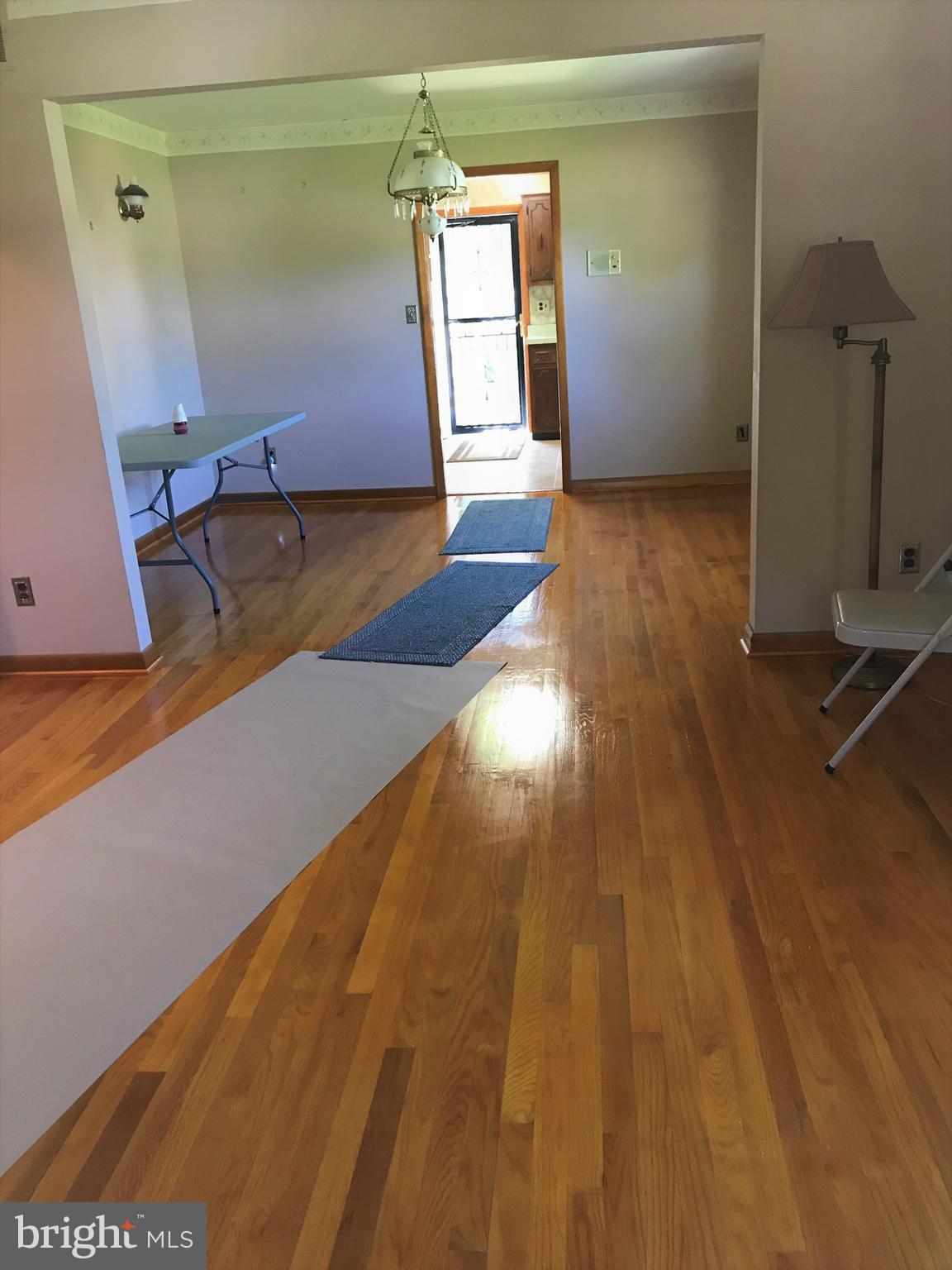 2306 Ruth Avenue Baltimore, MD 21219 - Photo 6 of 19 a view of a room with wooden floor and chair