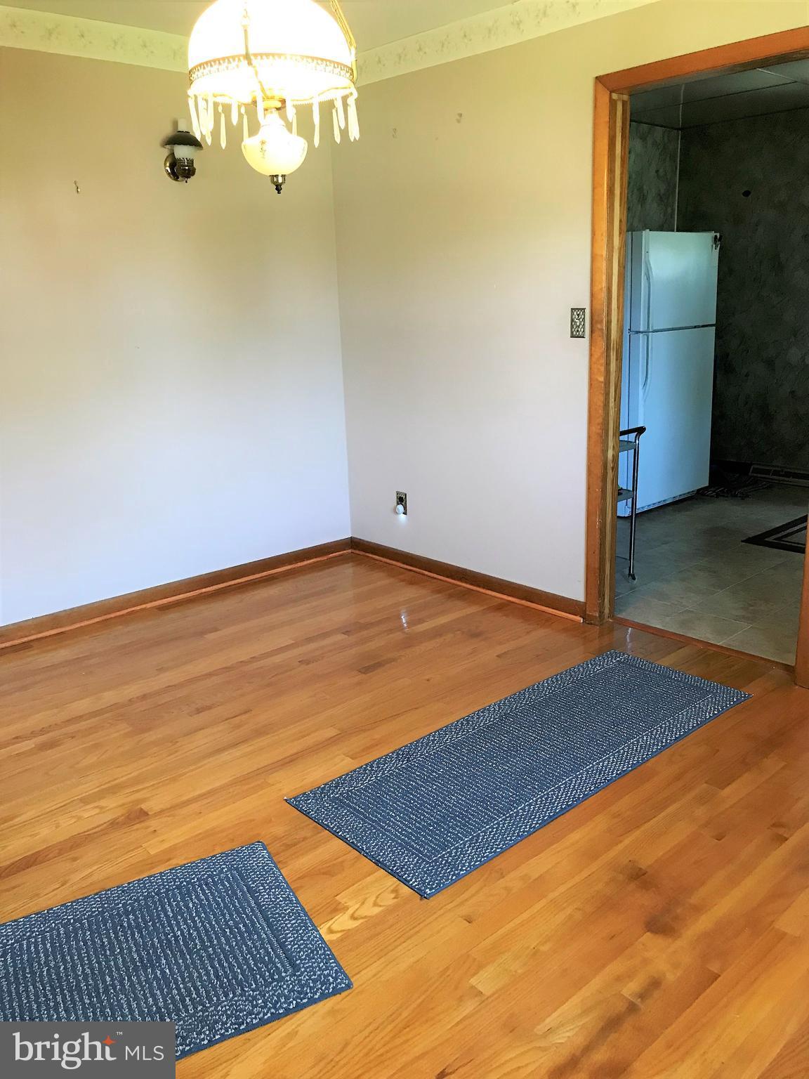 2306 Ruth Avenue Baltimore, MD 21219 - Photo 7 of 19 a view of a room with wooden floor