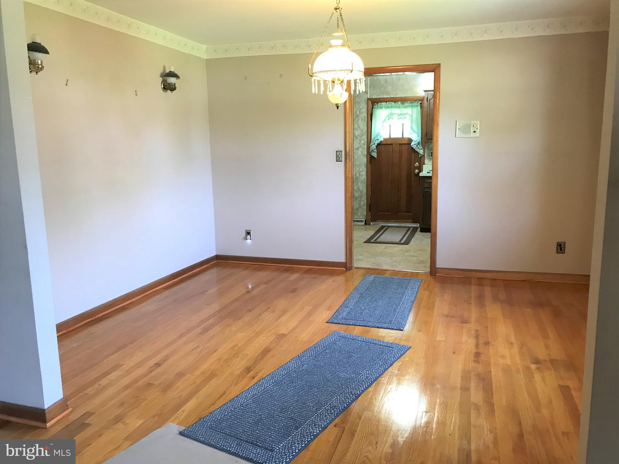 2306 Ruth Avenue Baltimore, MD 21219 - Photo 8 of 19 a view of a room with wooden floor
