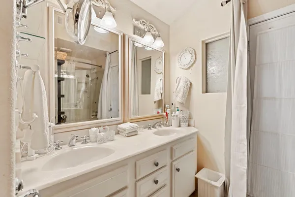 a bathroom with a toilet a sink and a shower